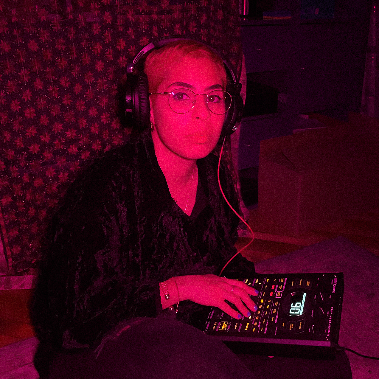 A photo of Nedda Baba with a sampler